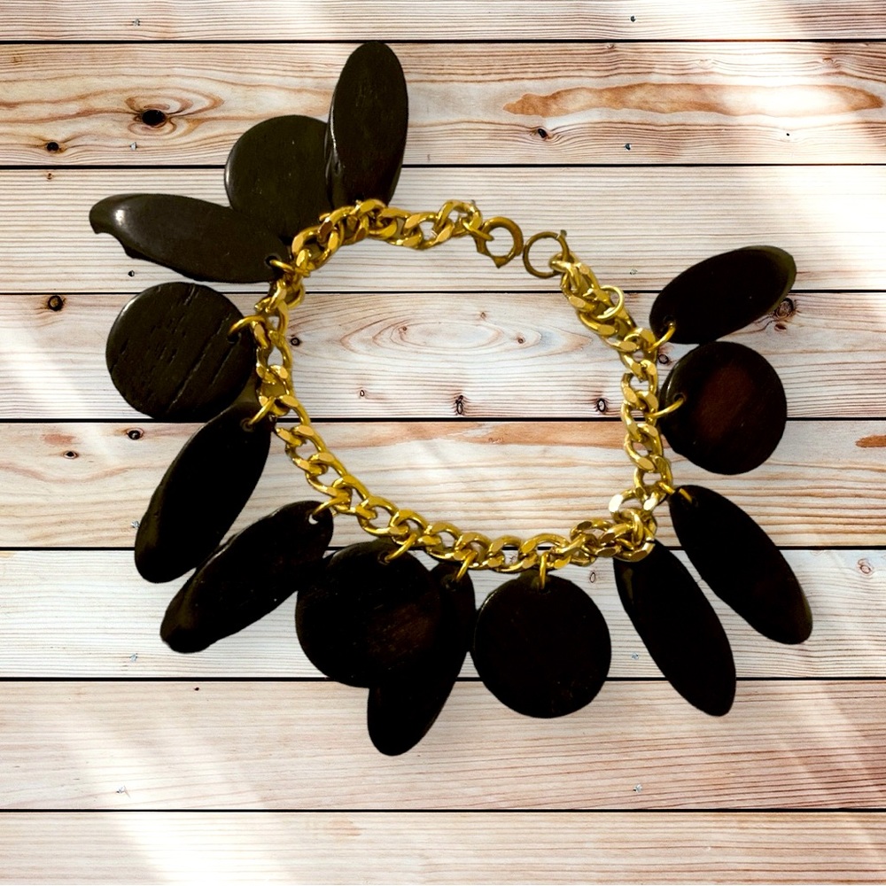 Gold Boutique Bracelet w/ black oval & circular wood dangling medallion